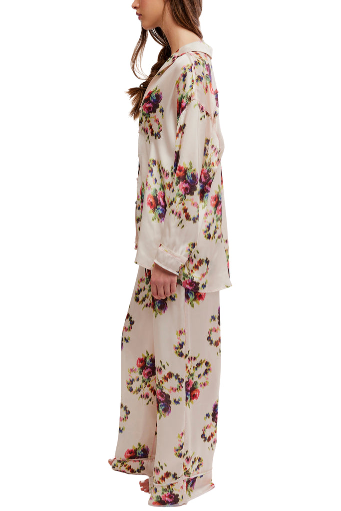 silky pajama set from free people in an ivory floral pattern