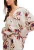 silky pajama set from free people in an ivory floral pattern