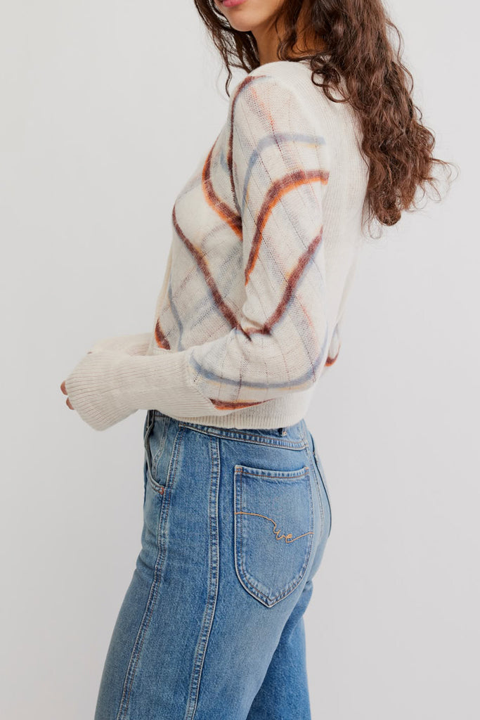 free people fitted white cardigan with a muted plaid design