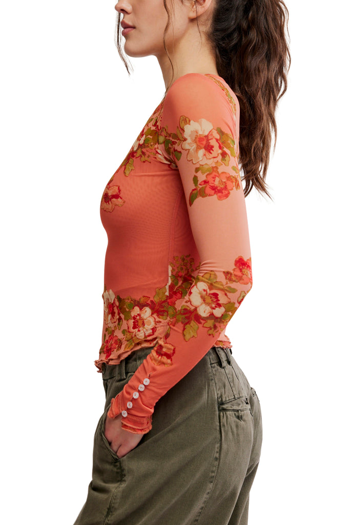 free people mesh long sleeve top in a peachy apricot color with a lovely floral design.