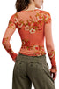free people mesh long sleeve top in a peachy apricot color with a lovely floral design.