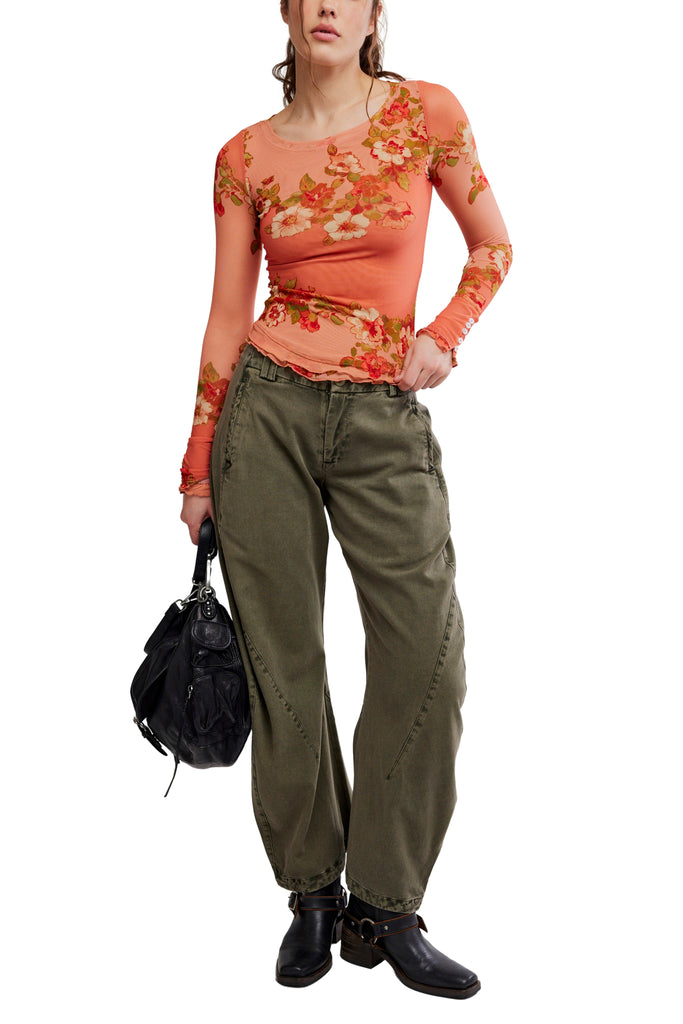 free people mesh long sleeve top in a peachy apricot color with a lovely floral design.