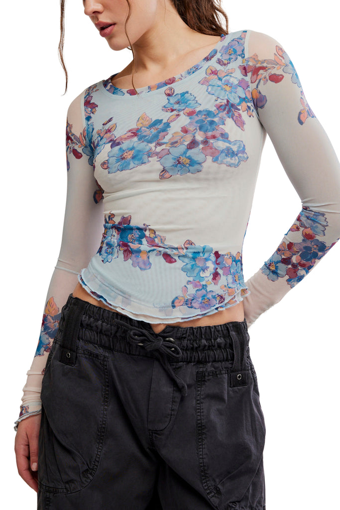free people mesh long sleeve top in frost blue with a colorful, blue-hued floral design.