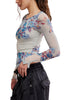 free people mesh long sleeve top in frost blue with a colorful, blue-hued floral design.