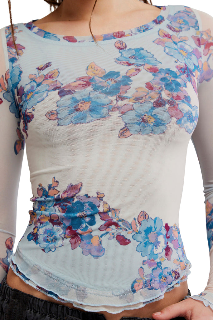 free people mesh long sleeve top in frost blue with a colorful, blue-hued floral design.
