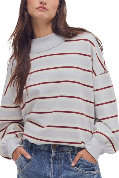 free people oversized pullover in washed sky blue, white, and burgundy stripes.
