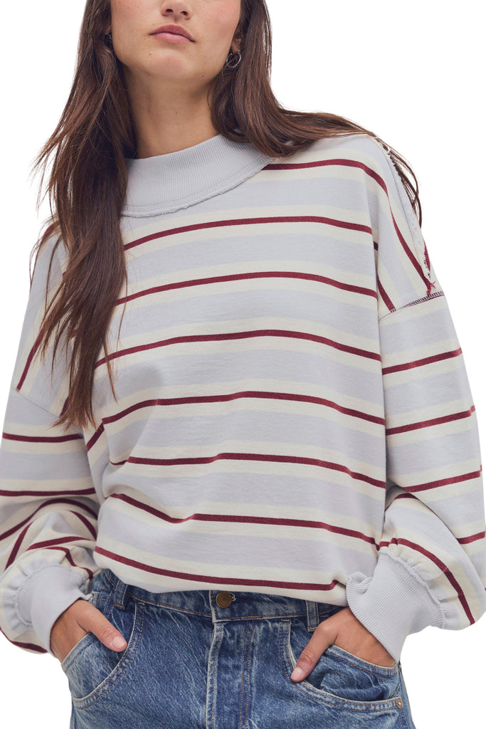 free people oversized pullover in washed sky blue, white, and burgundy stripes.
