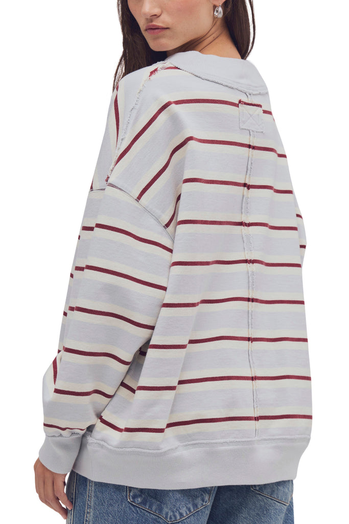 free people oversized pullover in washed sky blue, white, and burgundy stripes.