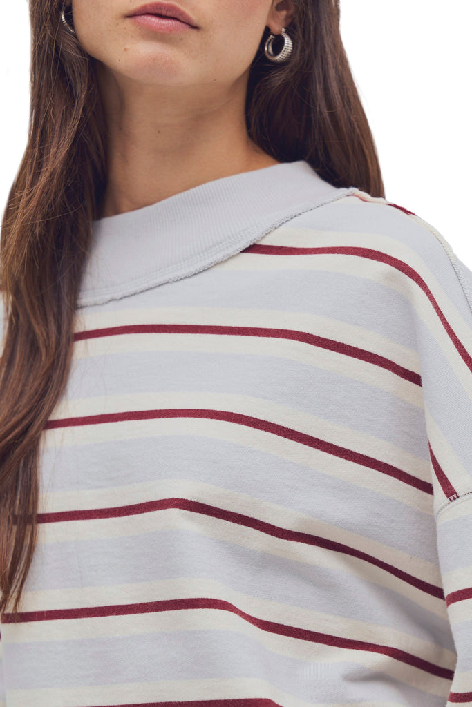 free people oversized pullover in washed sky blue, white, and burgundy stripes.