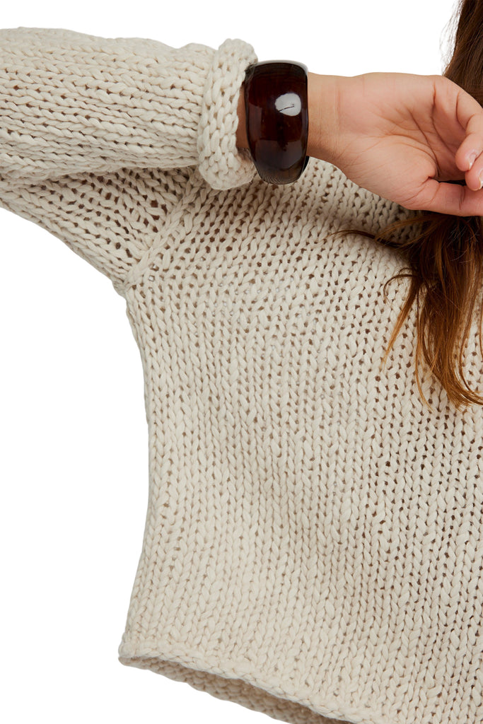 free people lightweight cotton sweater with dropped shoulders and a rolled neckline