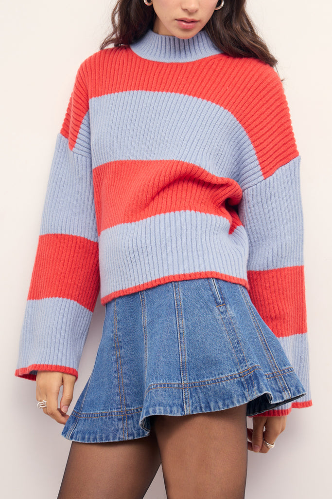 chunky knit sweater in fiery coral and pale periwinkle blue stripes. 