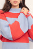 chunky knit sweater in fiery coral and pale periwinkle blue stripes. 