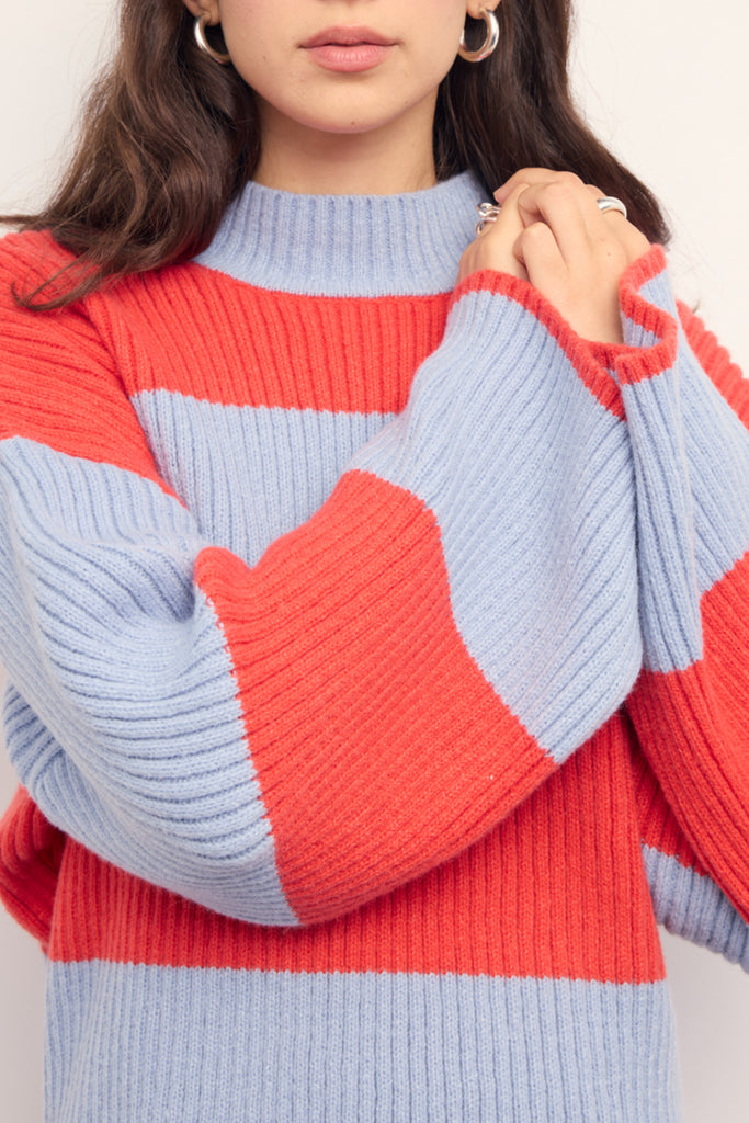 chunky knit sweater in fiery coral and pale periwinkle blue stripes. 