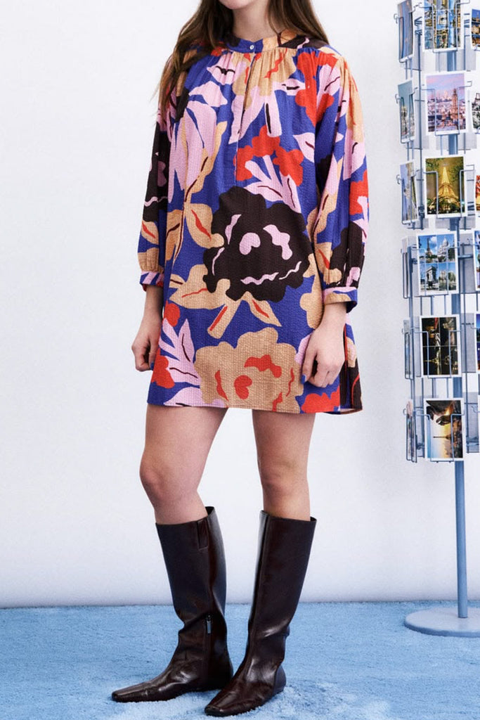 striking mini dress in a brightly colored floral pattern
