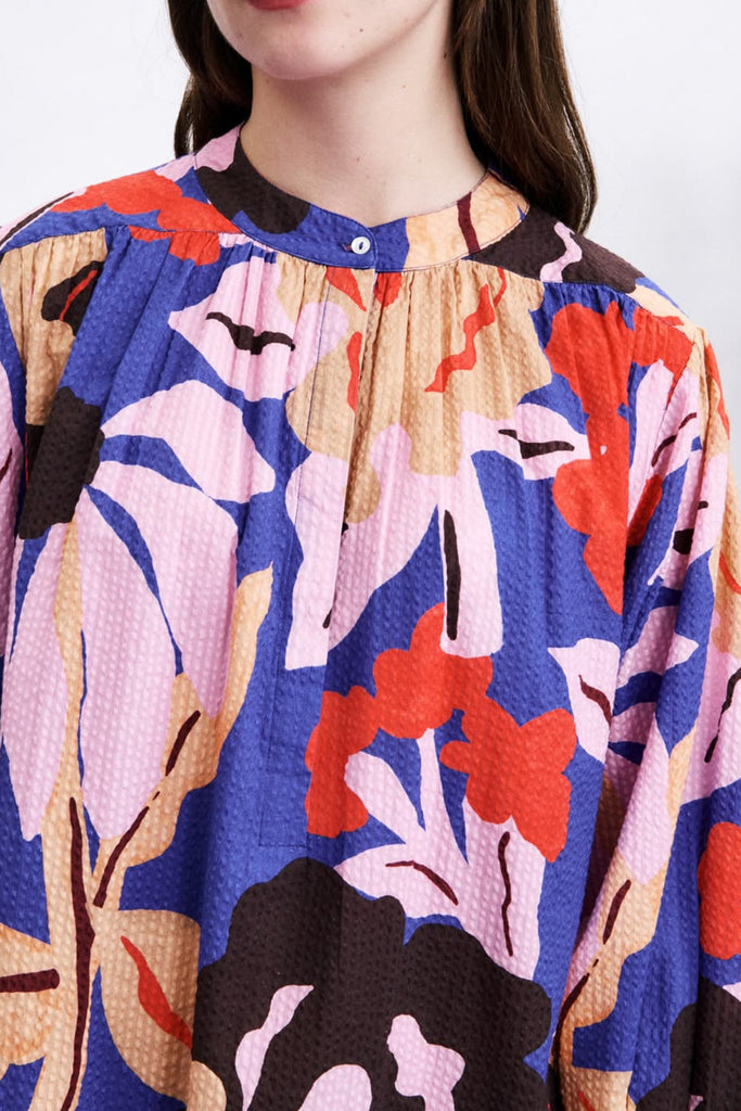 striking mini dress in a brightly colored floral pattern