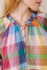 flowy maxi dress in a colorful plaid pattern