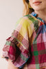 flowy maxi dress in a colorful plaid pattern