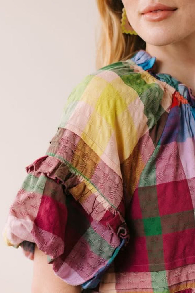 flowy maxi dress in a colorful plaid pattern