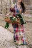 flowy maxi dress in a colorful plaid pattern
