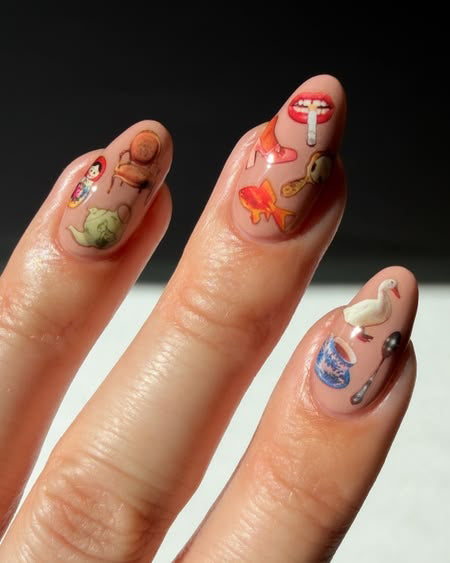 whimsical nail stickers applied to a manicure