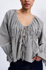 flowy tie front blouse in a black and white geometric print