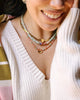 herringbone heart necklace layered with other pieces