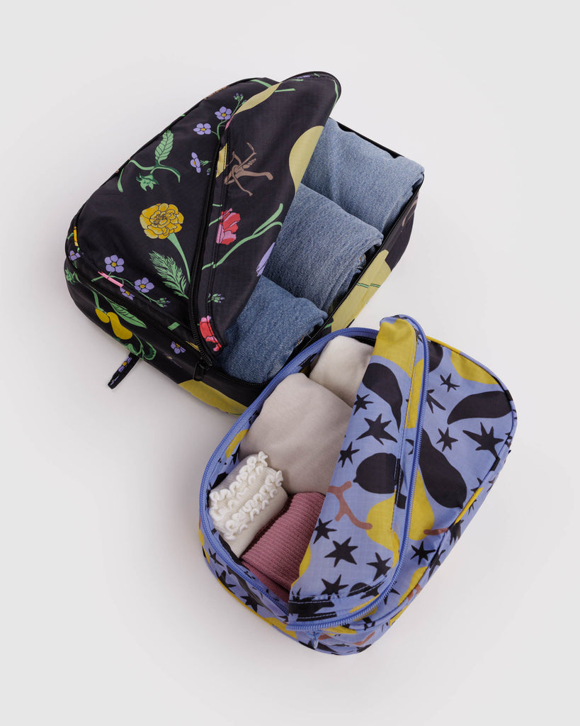 holiday packing cube set in winter orchard