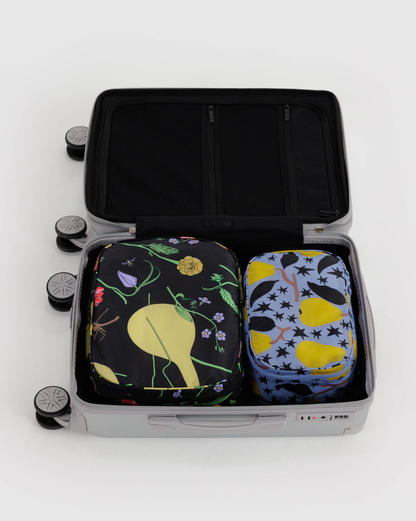 holiday packing cube set in winter orchard