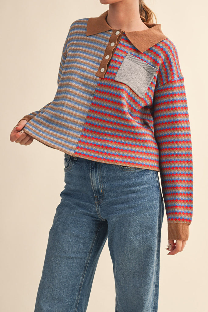unique sweater in camel, grey, bright blue, and red stripes.