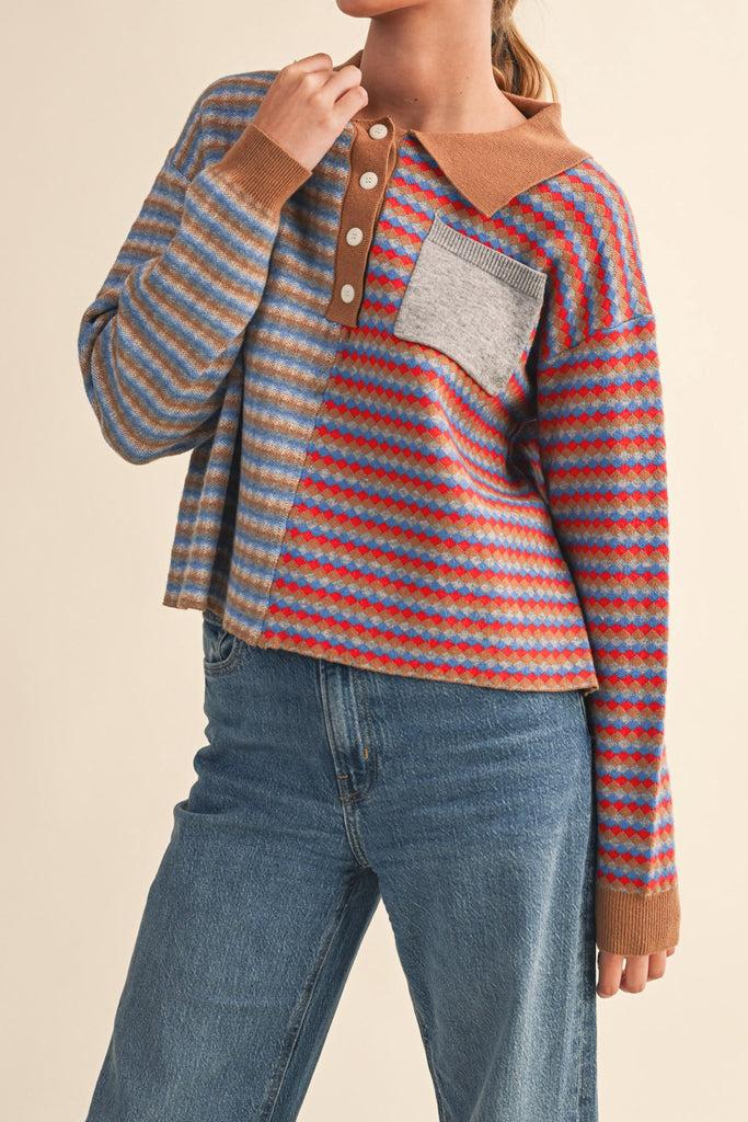 unique sweater in camel, grey, bright blue, and red stripes.