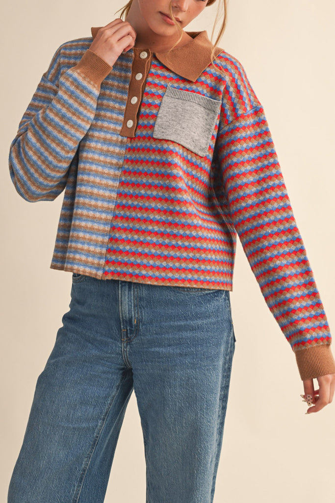 unique sweater in camel, grey, bright blue, and red stripes.