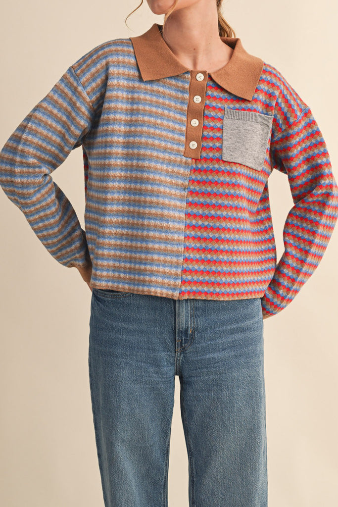unique sweater in camel, grey, bright blue, and red stripes.