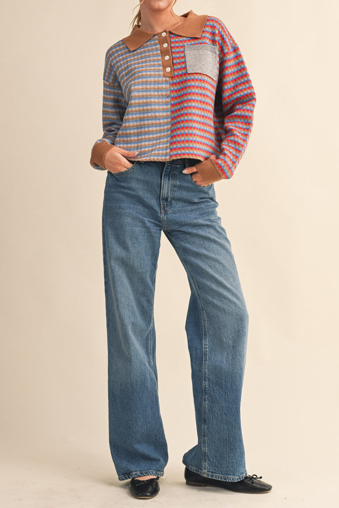 unique sweater in camel, grey, bright blue, and red stripes.