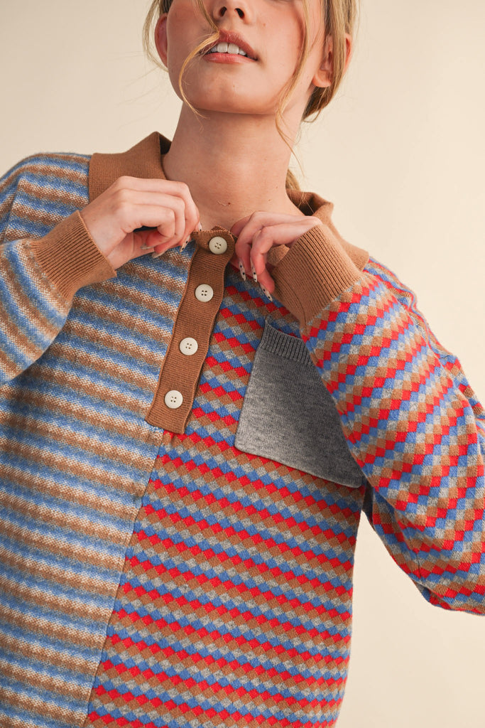 unique sweater in camel, grey, bright blue, and red stripes.
