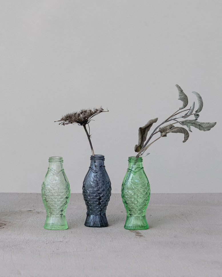 small colored glass vase in the shape of a fish