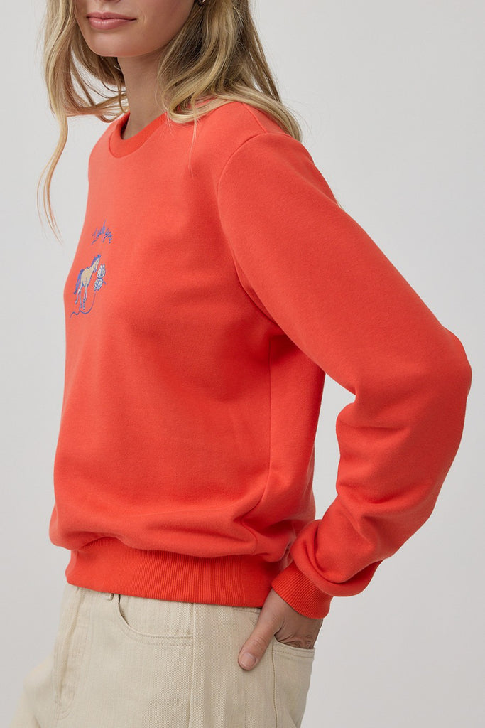 orange crew neck sweatshirt with an embroidered horse design and the message "lucky you."