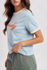 sky blue ringer tee with the message "howdy" in bold orange