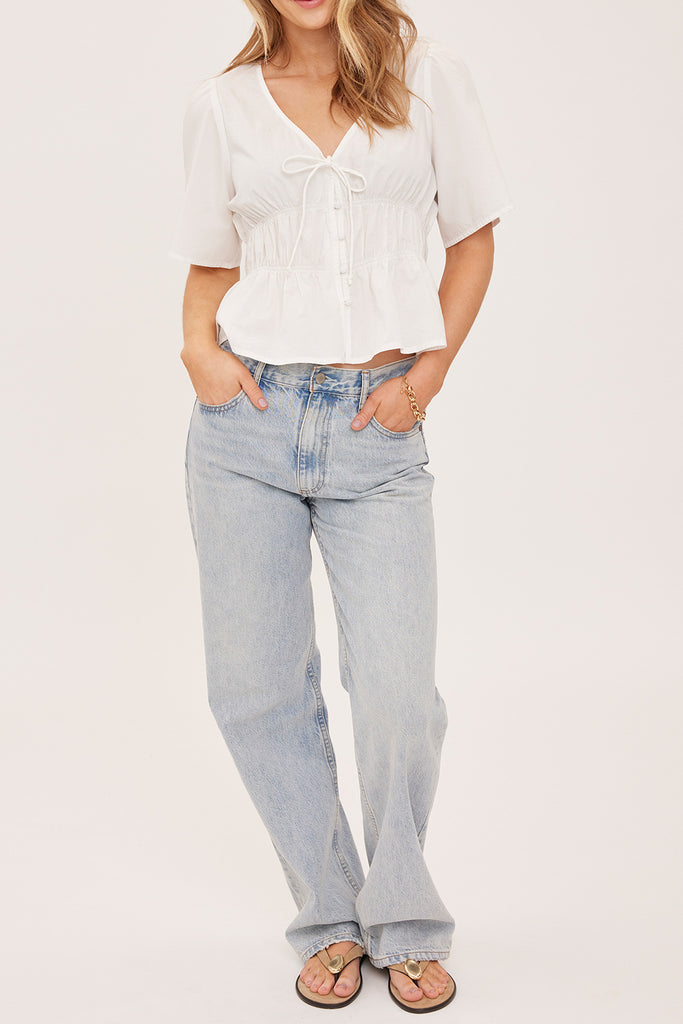 romantic feeling white blouse with v neckline and gathered waist 