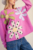 washed magenta sweatshirt with flower applique details