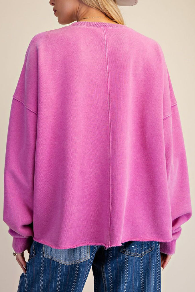 washed magenta sweatshirt with flower applique details