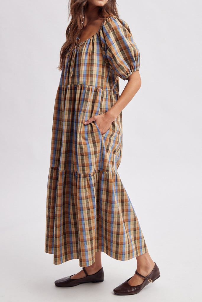 roomy midi dress in a brown plaid pattern