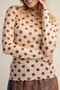 long sleeve mesh top in a pale peachy color with chocolate brown polka dots.