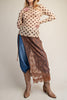 long sleeve mesh top in a pale peachy color with chocolate brown polka dots.