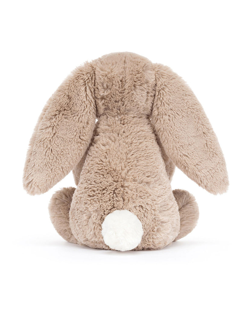 bashful beige birthday bunny, plush beige bunny holding a smiling birthday cake topped with strawberries and a candle
