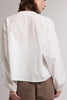 white button down top with a gathered neckline and roomy long sleeves