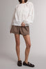 white button down top with a gathered neckline and roomy long sleeves