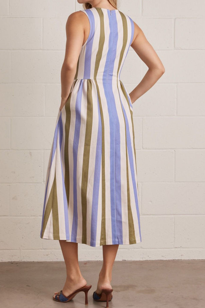 sleeveless dress made from a lightweight denim in olive green, periwinkle blue, and white vertical stripes.