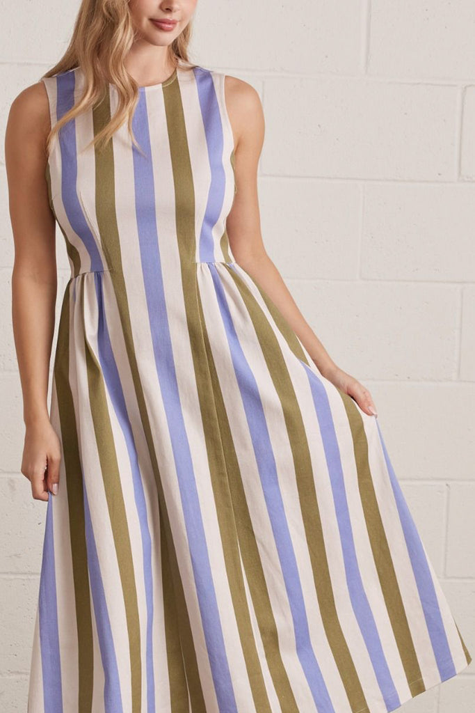 sleeveless dress made from a lightweight denim in olive green, periwinkle blue, and white vertical stripes.