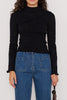 slim-fitting knit top in black with special pointelle detailing throughout