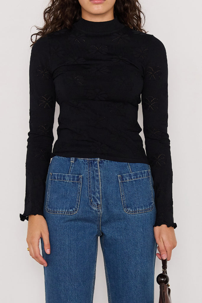 slim-fitting knit top in black with special pointelle detailing throughout